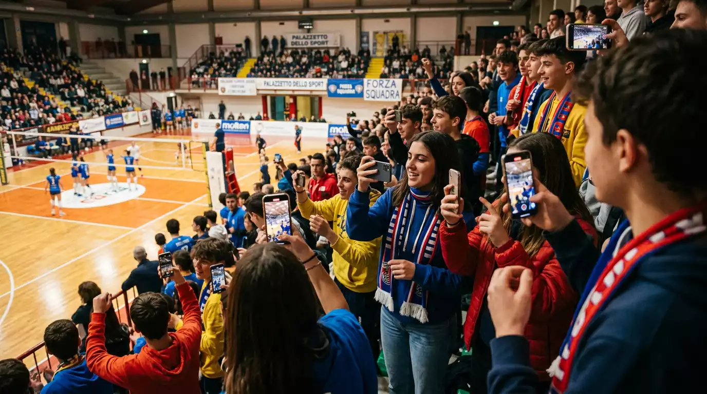 Tifosi seguono la pallavolo femminile con gli smartphone dalle tribune del palazzetto